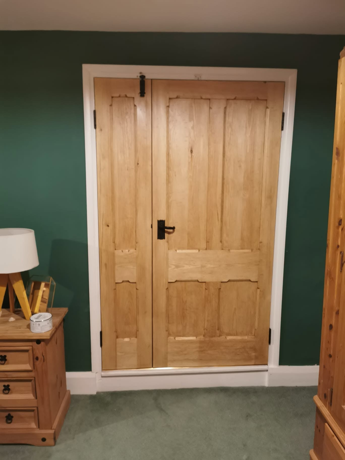 Handcrafted oak double doors with traditional ironmongery